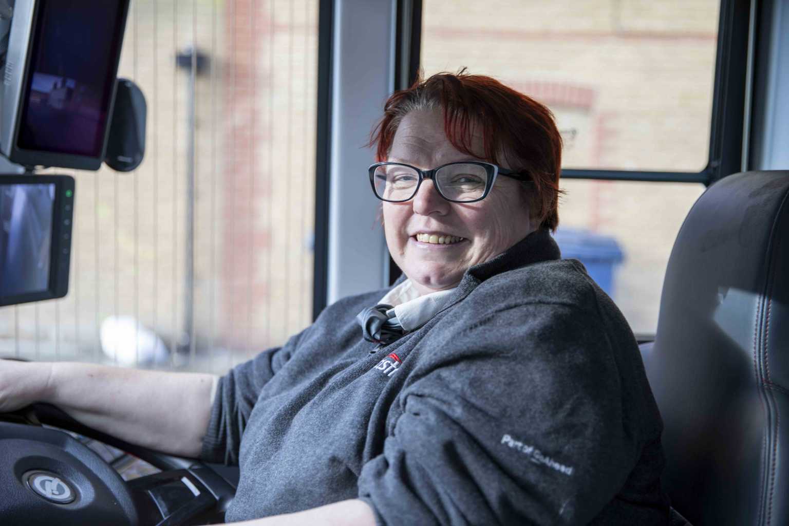 Bus driver smiling