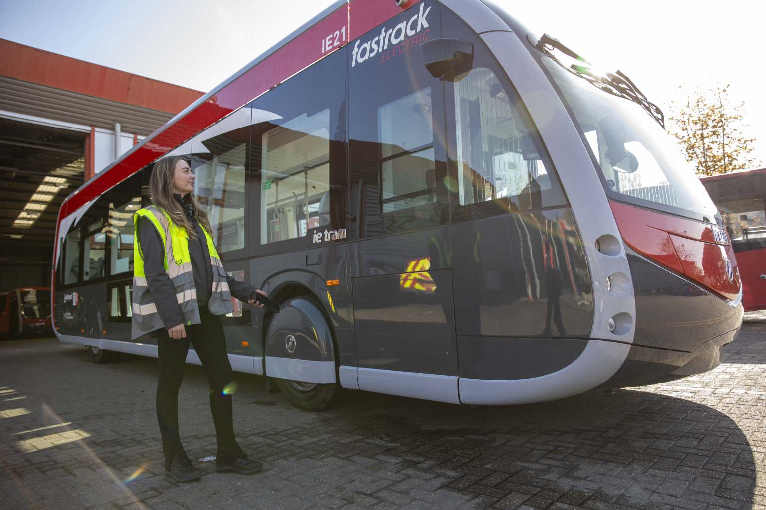 Fastrack driver inspecting new Fastrack bus