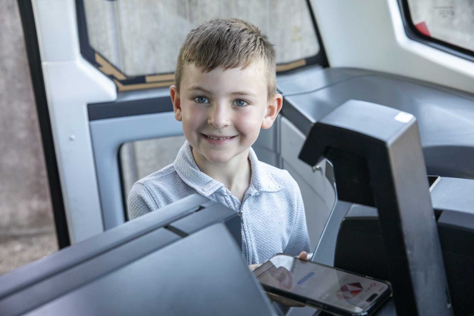 Boy paying for bus