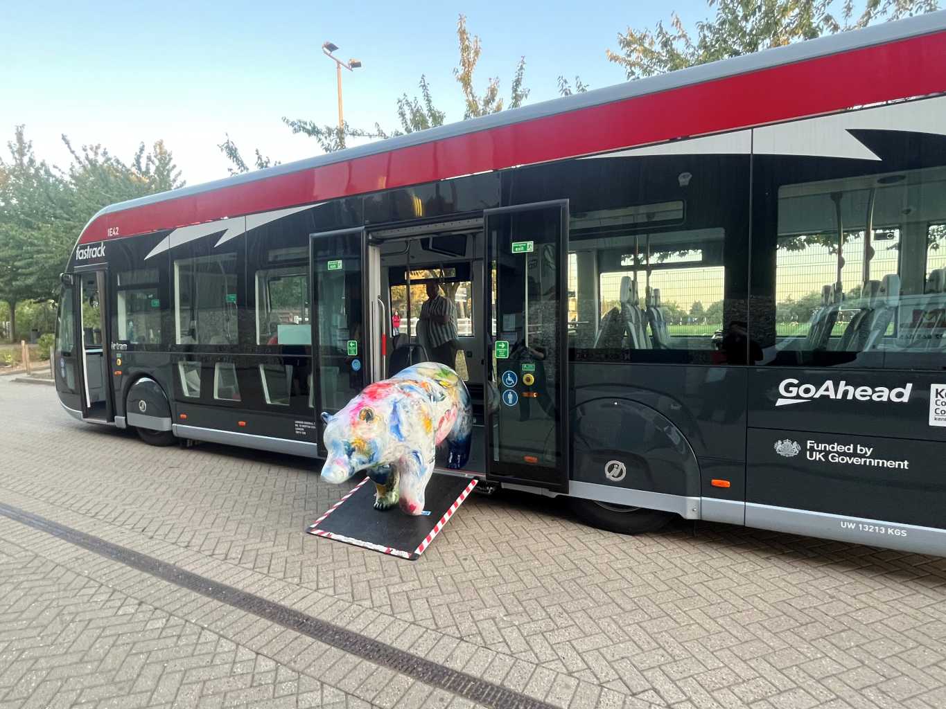 Bear sculpture on the ramp of a new Fastrack bus